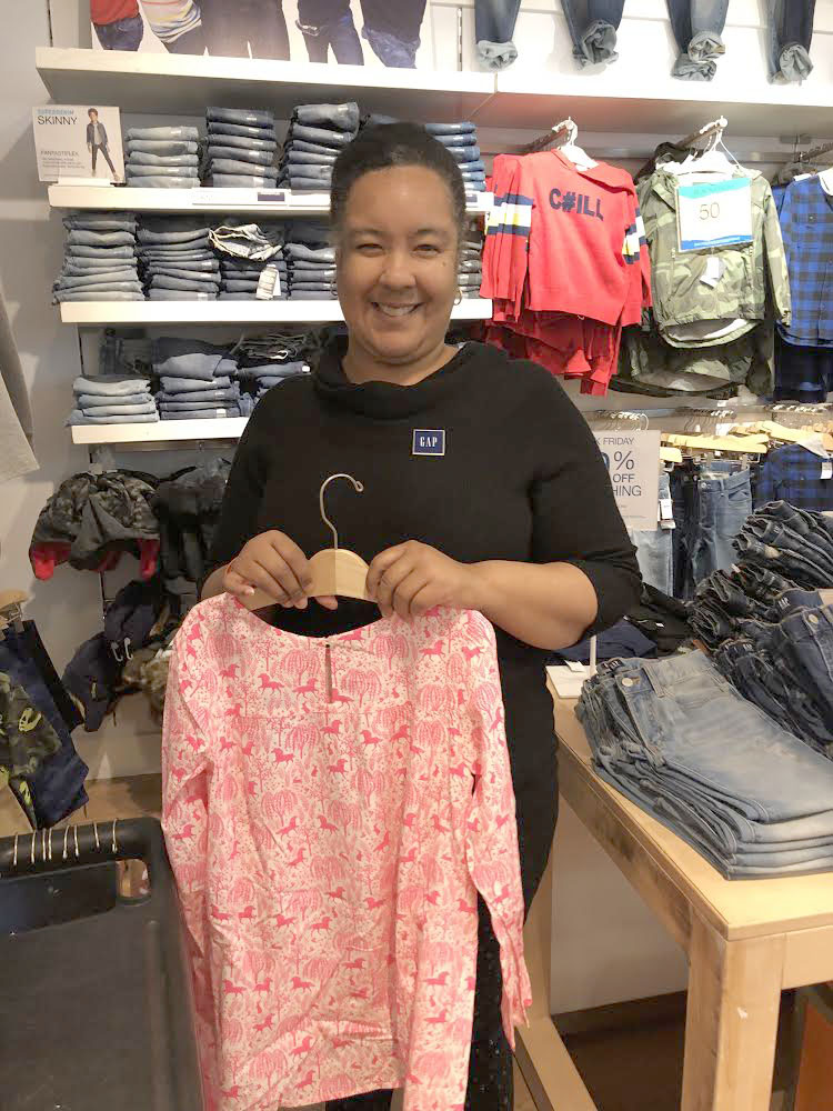 Photo of Christine happily working at the GAP store