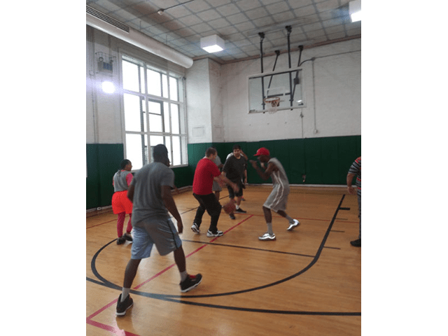 Job Path participants playing basketball together.