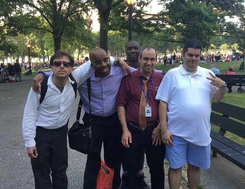 A group of 5 Job Path participants standing together at a park.
