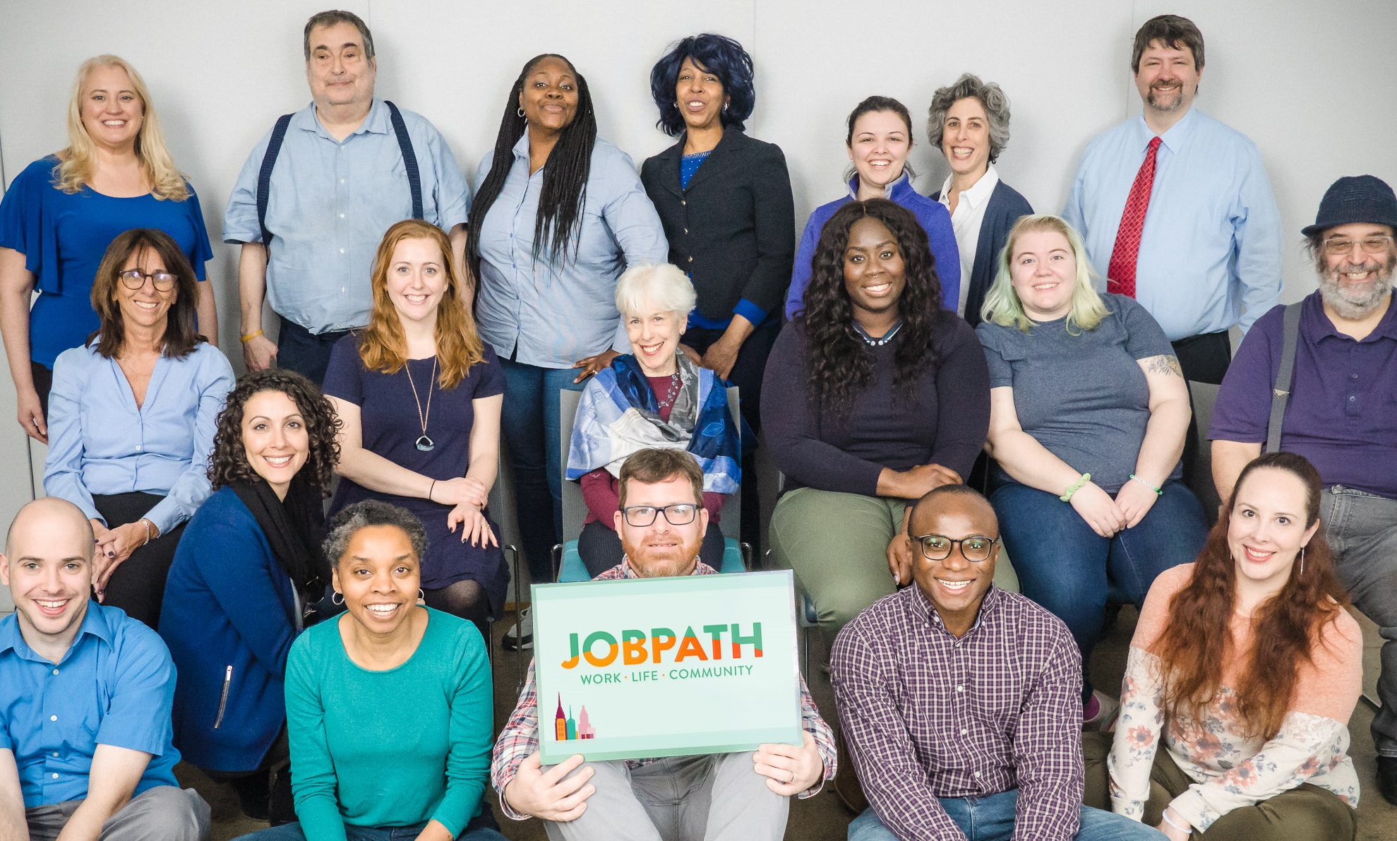 JP Autism Awareness 2020 - Copy A group nineteen of Job Path employees are posed looking at the camera