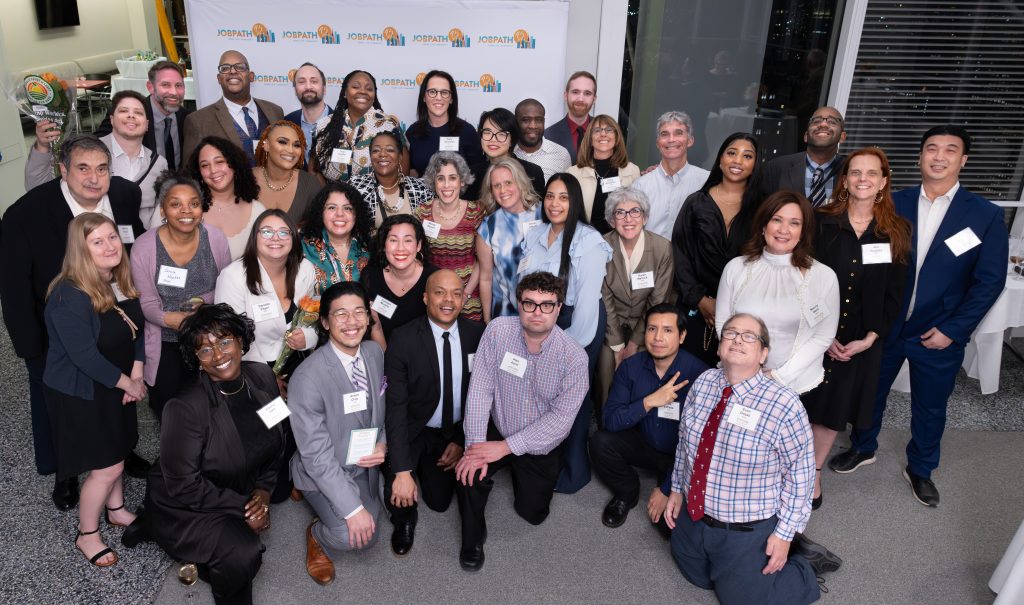 About 40 Job Path staff taking a group photo. It shows the diversity of the staff.